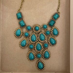 Costume jewelry, statement necklace in gold with turquoise stones